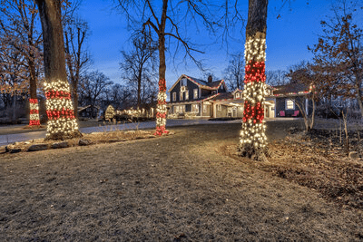 Beautiful two-story house and landscape with impressive outdoor Christmas lights